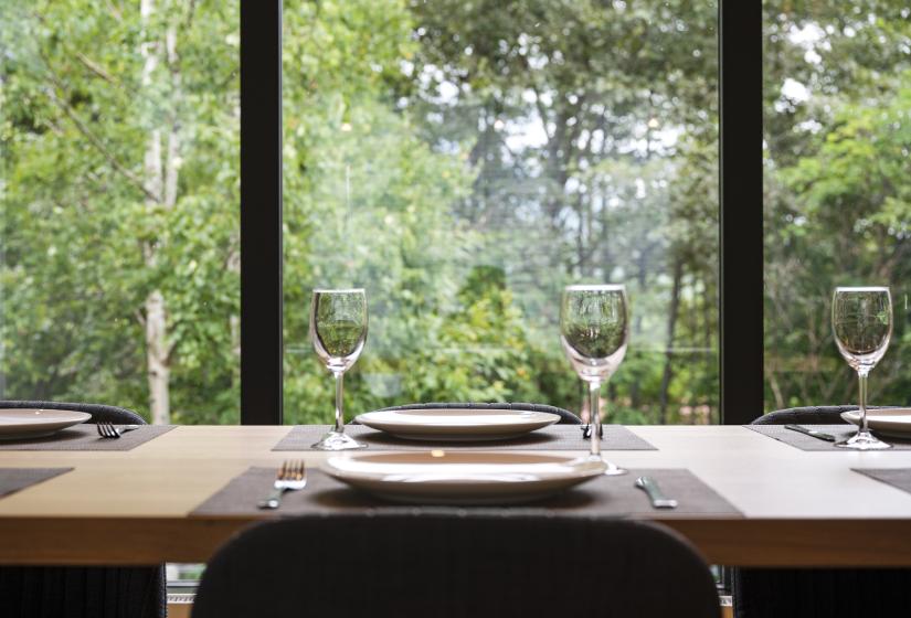 A set dining table with wine glasses