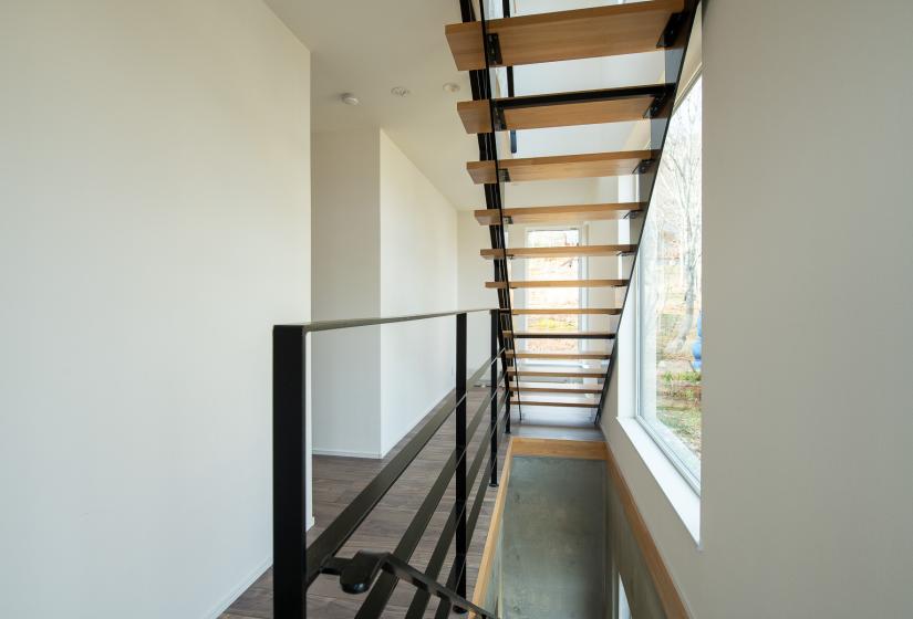 2nd floor stairway with window to the riht