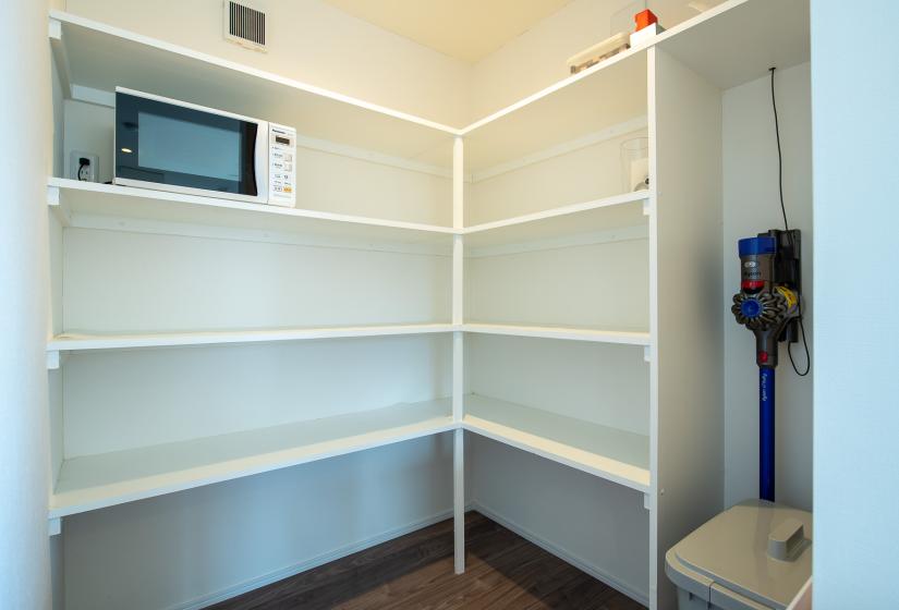 Empty white pantry shelves