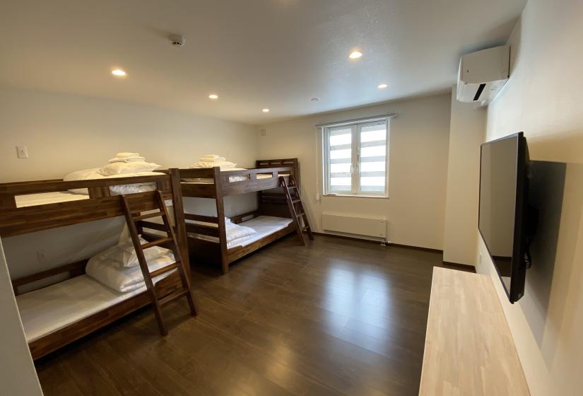 A white room with bunks
