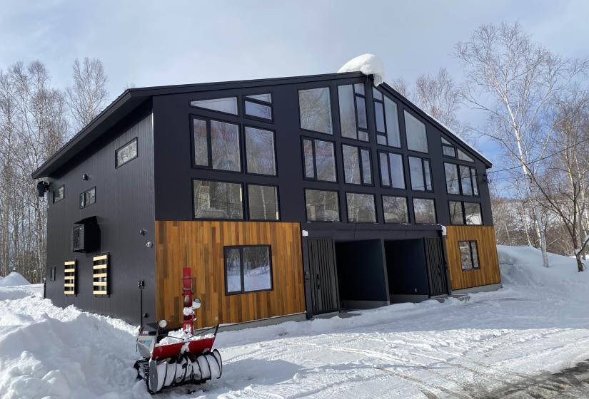 A large 2 bedroom duplex with two garages and steel and wooden cladding