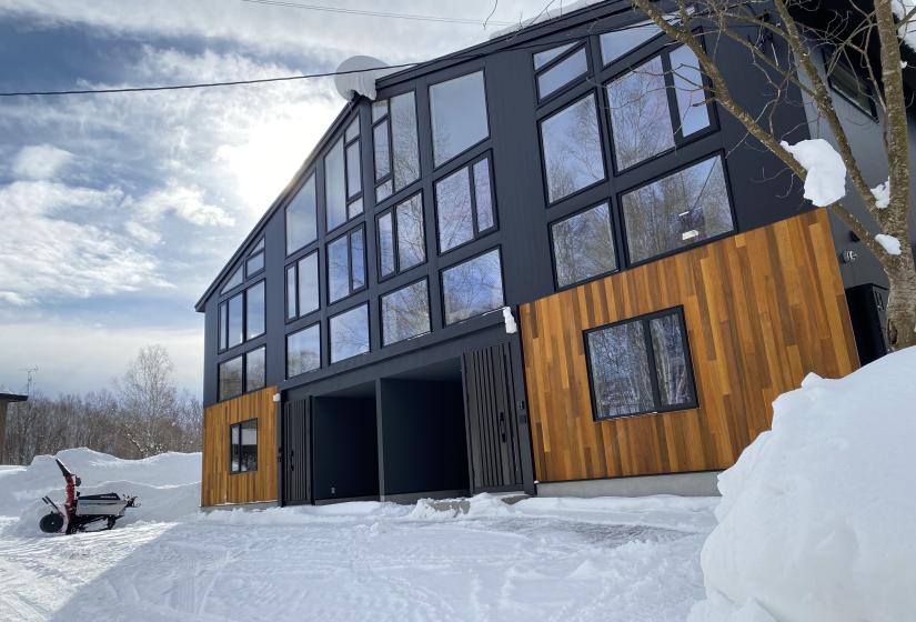 A large 2 bedroom duplex with two garages and steel and wooden cladding