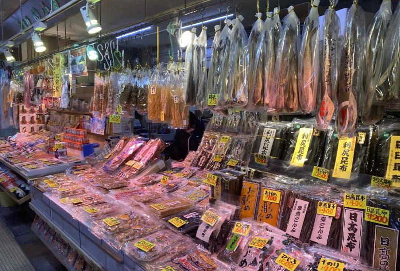 Long shelves of packaged seafood products such as kelp and dried fish.