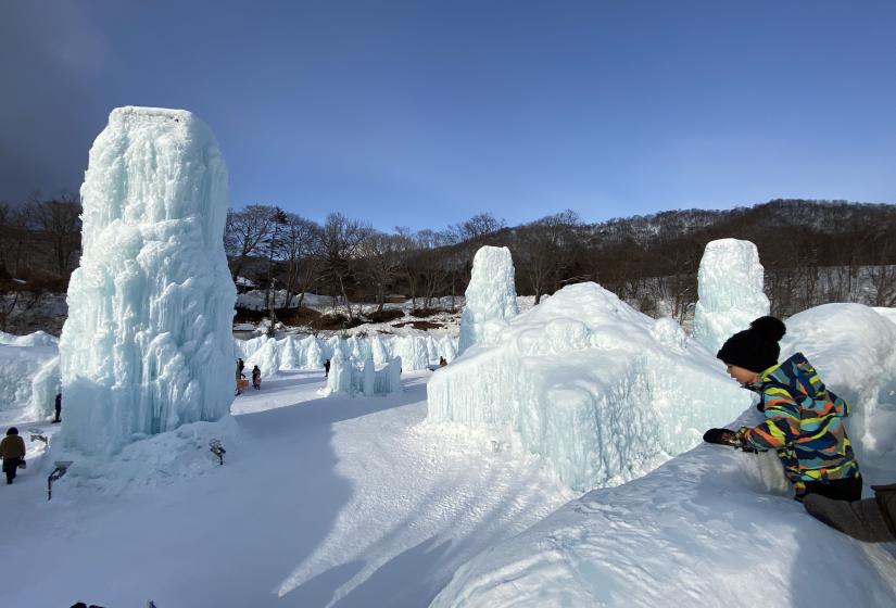 A child peers over the edge of an ice sculpture.