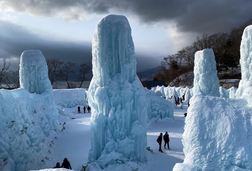 Giant ice sculptures with dramatic black clouds behind