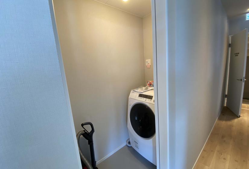 A washing machine in a closet
