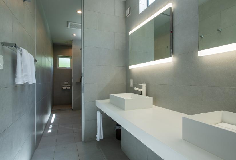 Downstairs bathroom with white sinks