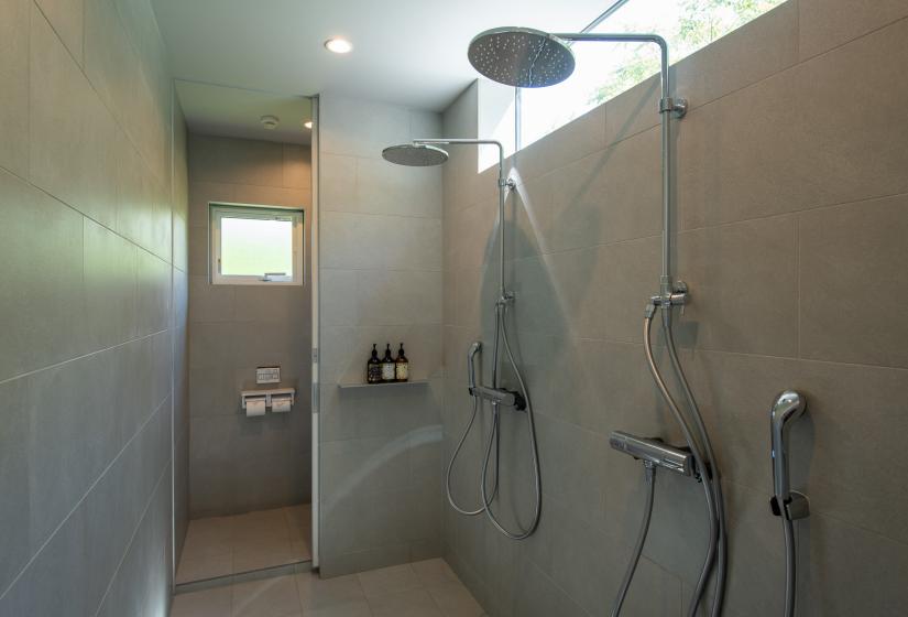 Downstairs bathroom with rain showers