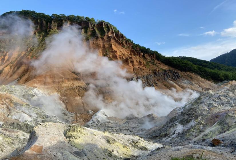 The scenery around Jigokudani or Hell Valley is spectacular with dramatic cliffs and steaming volcanic vents. Noboribetsu's hell valley with steaming volcanic vents