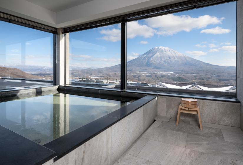 A large square onsen bath and yotei view