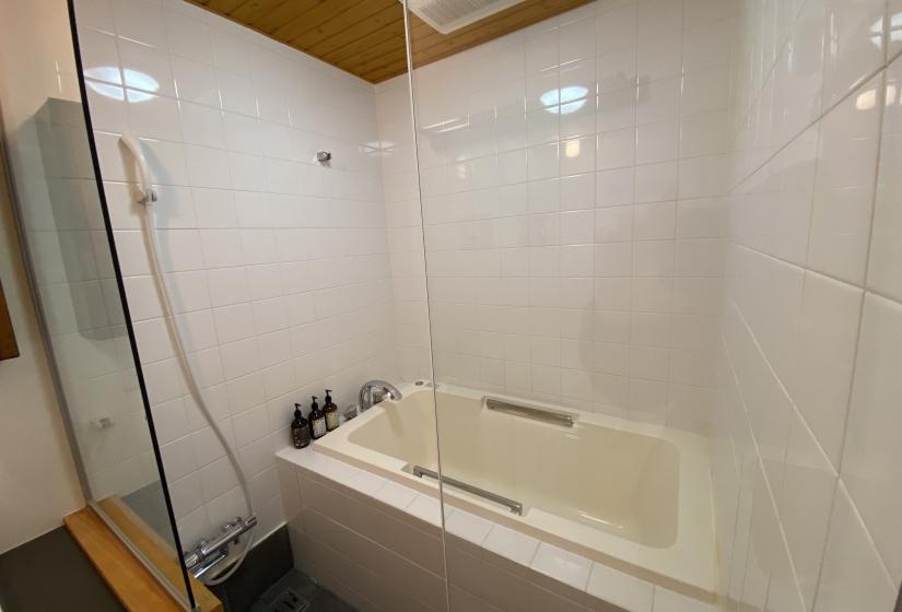 Bath in tiled bathroom