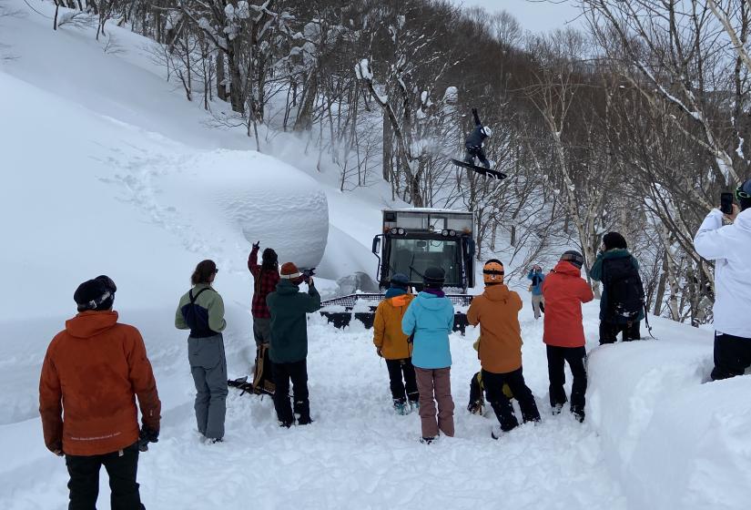One of the greatest snowboarders of all time Terje Haakonsen still throwing down with timeless style A snowboarder jumps over a snow cat in front of onlookers