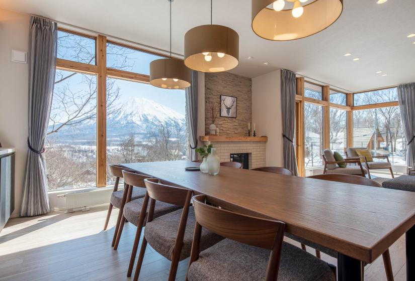 A dining table and hanging lights