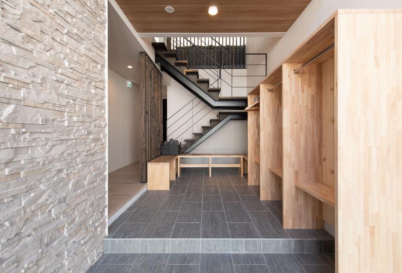 An entry way with stairs behind