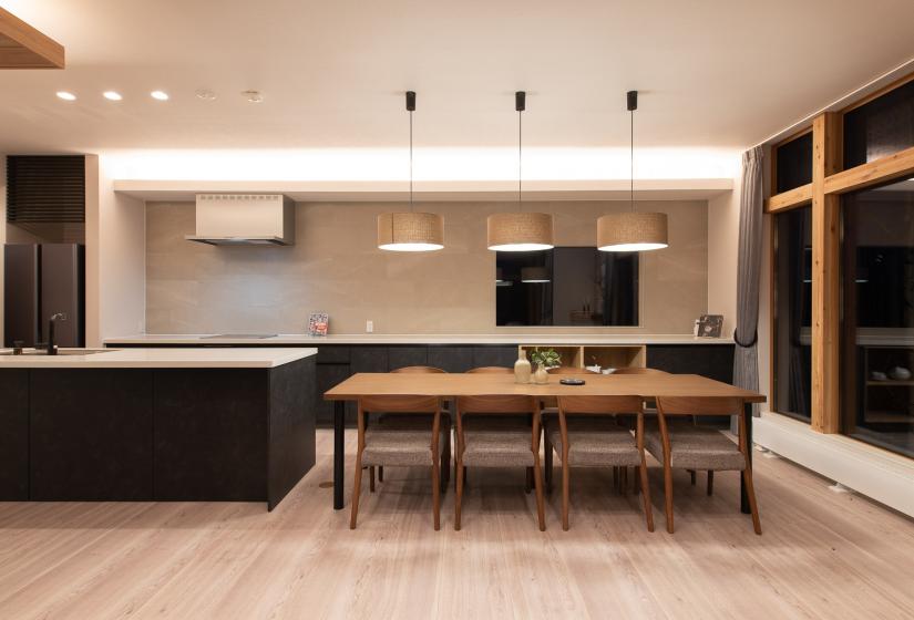 Kitchen and dining A dining table and kitchen behind