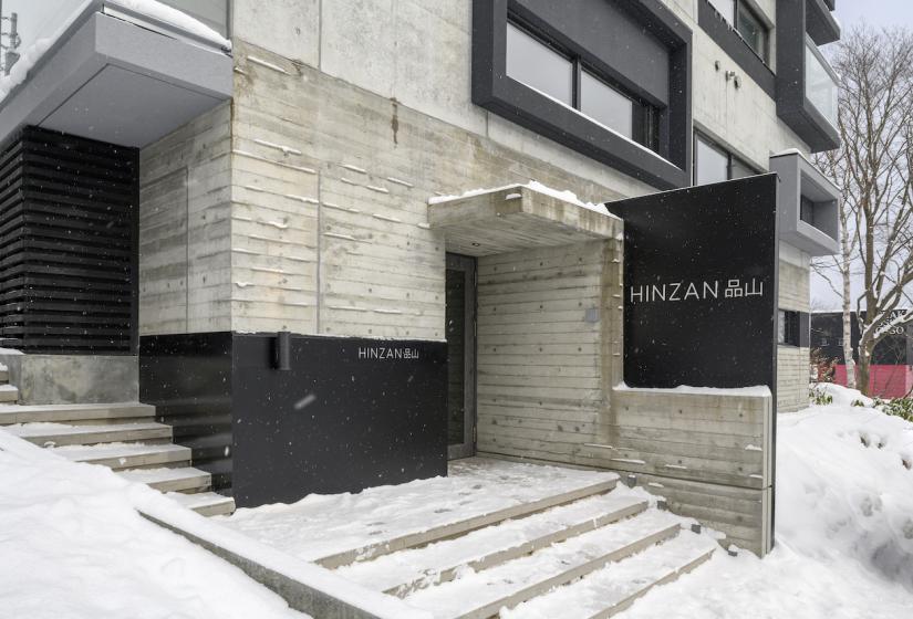 Hinzan Niseko exterior with snow ion stairs