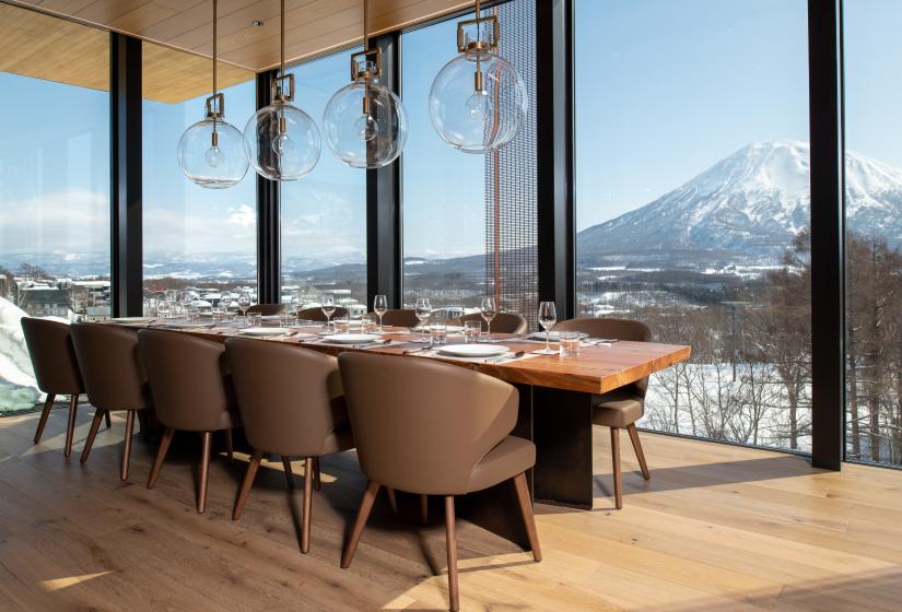 Intuition Niseko-4 BDR Yotei Penthouse A dining table and Yotei View behind