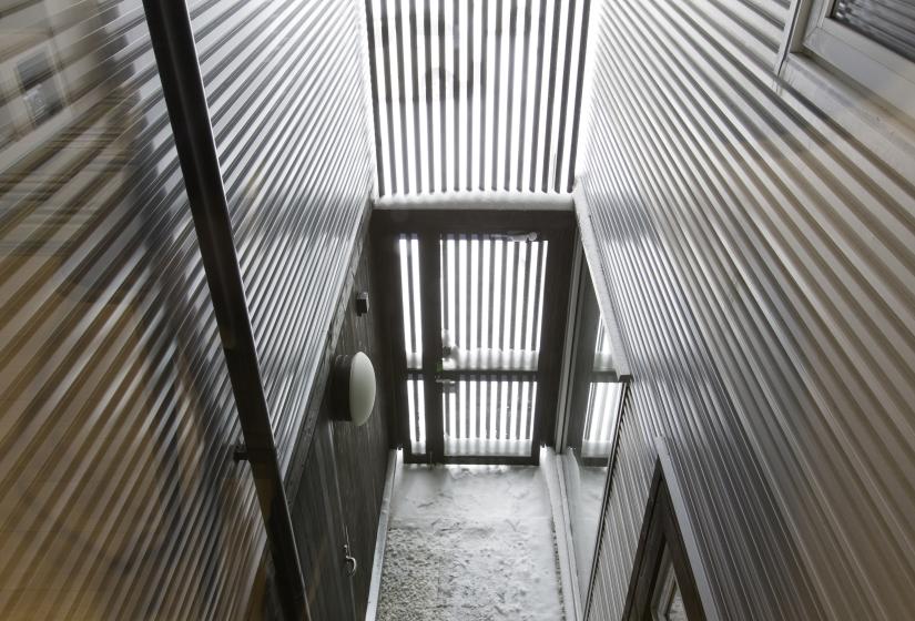 An entry way with slat facarde