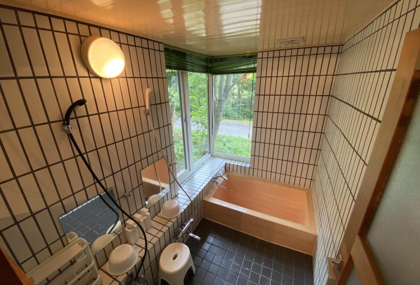 Tiled bath bathroom with orange bath