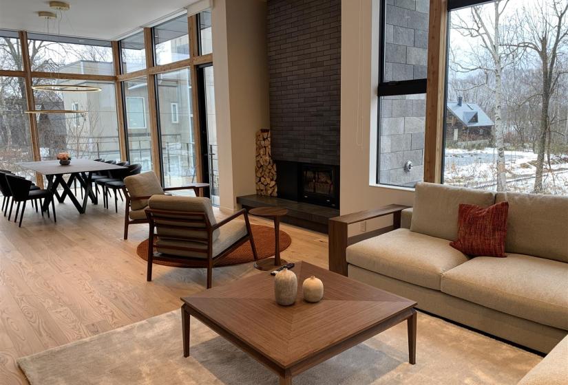 A lounge suite with dining table to the left.