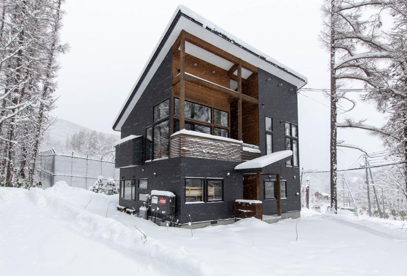 A two story house in snowy surrounds