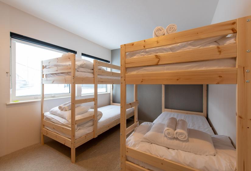 Two wooden bunk beds