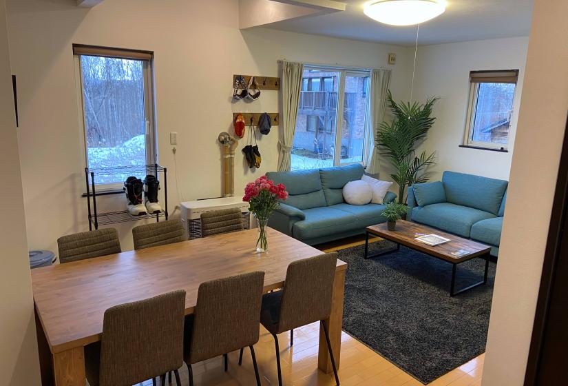 Yotei Chalets dining and lounge A dining table and lounge area