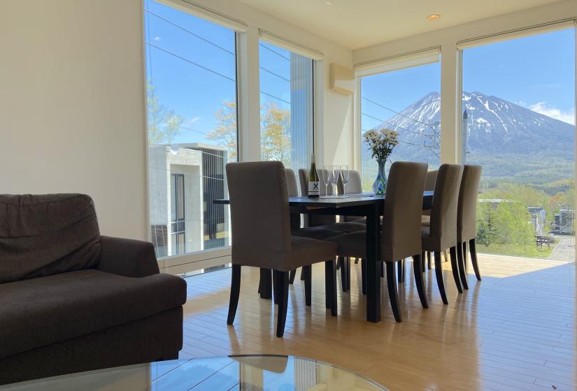 A dining table with mountain view behind.