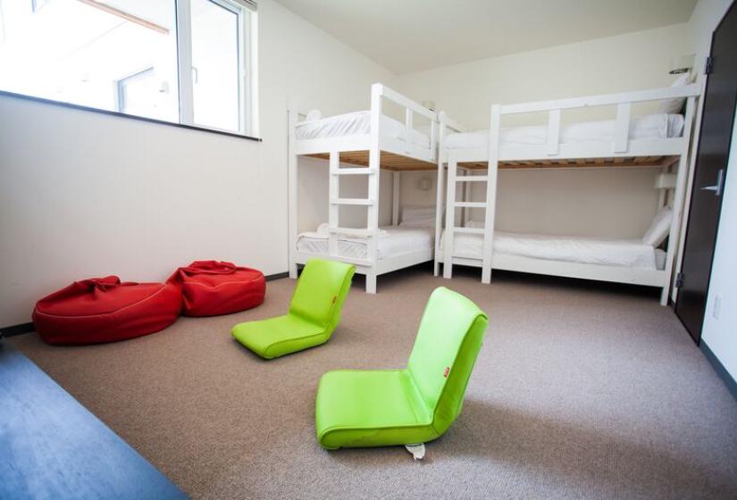 Bunkbeds and green chairs