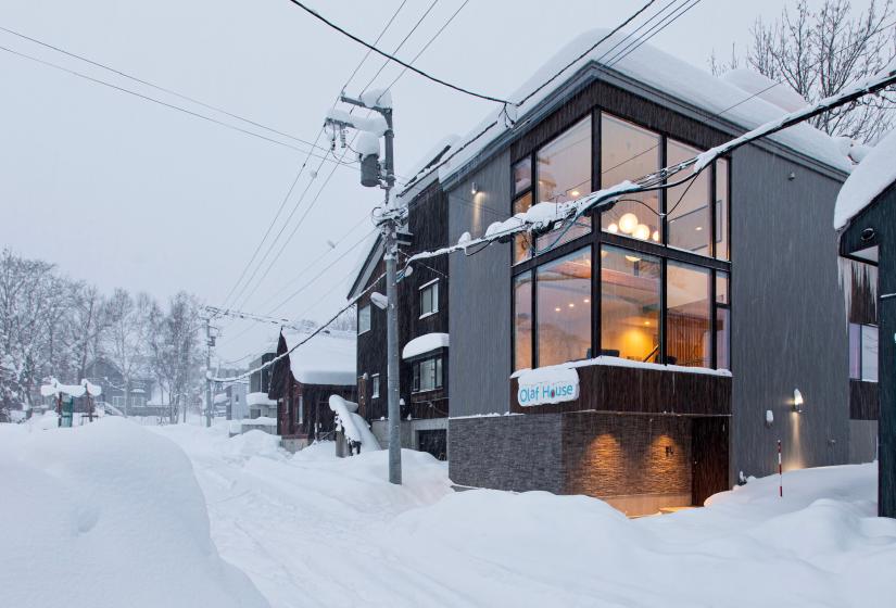 A large house on a snowy street