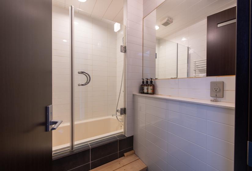 A white tiled bathroom