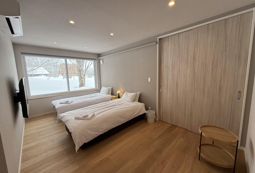 Two made up single beds