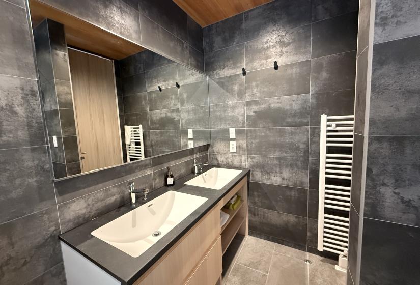 Twin sinks in a tiled bathroom