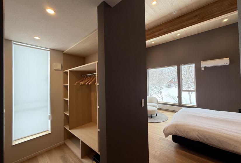 A wardrobe with bedroom behind