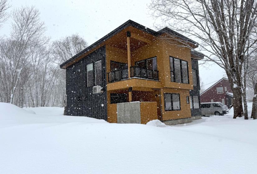 The exterior of a two storied wood and steel house  