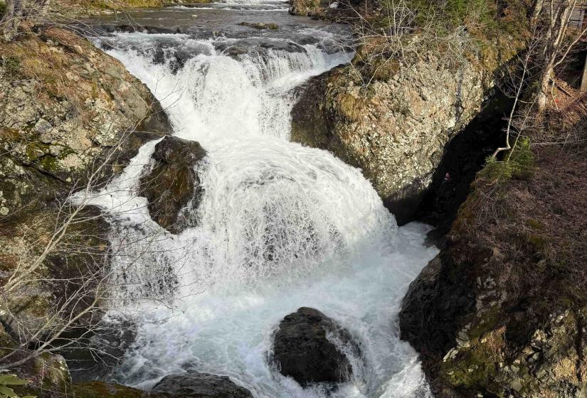 The center piece of the park, the Sangaitaki Waterfall cascading down its three levels. The white water of a waterfall.