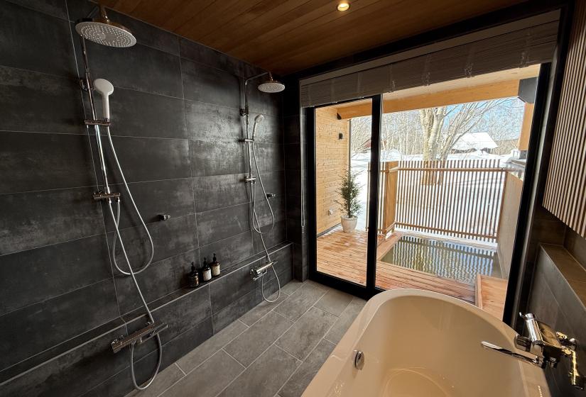 A bath tub in a tiled bathroom