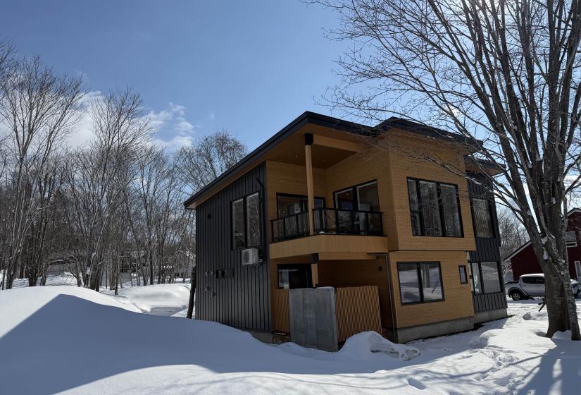 A two story house in the snow