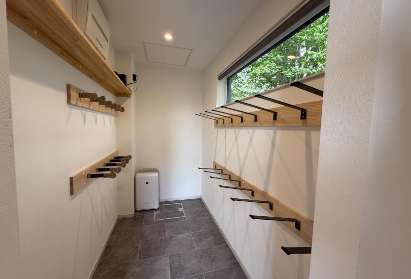 A hallway with ski racks on either side