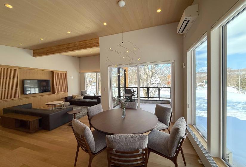Snow Onsen House in Royal Town, Annupuri comes complete with tranquil surrounds, winter views and its own private onsen. A round table in a large dining room