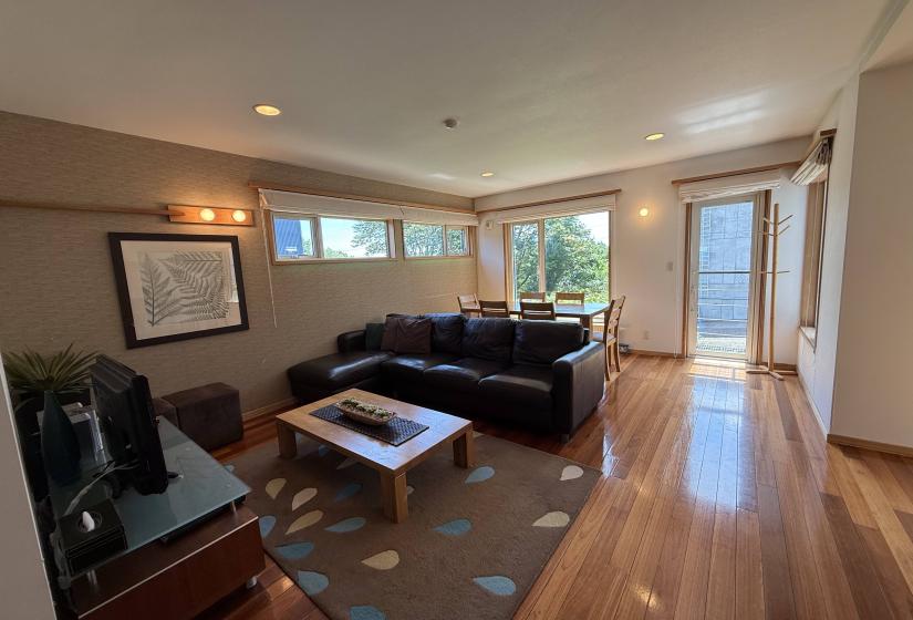 A black lounge with windows behind