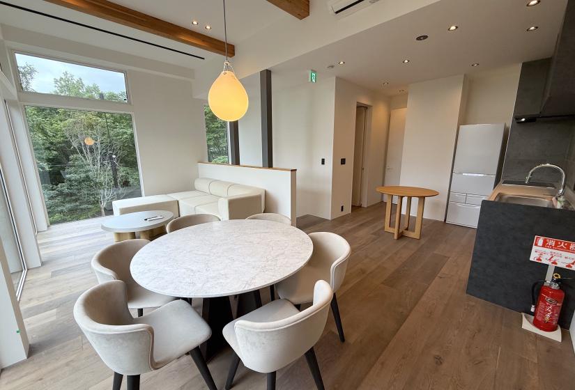 A white dining table with light above