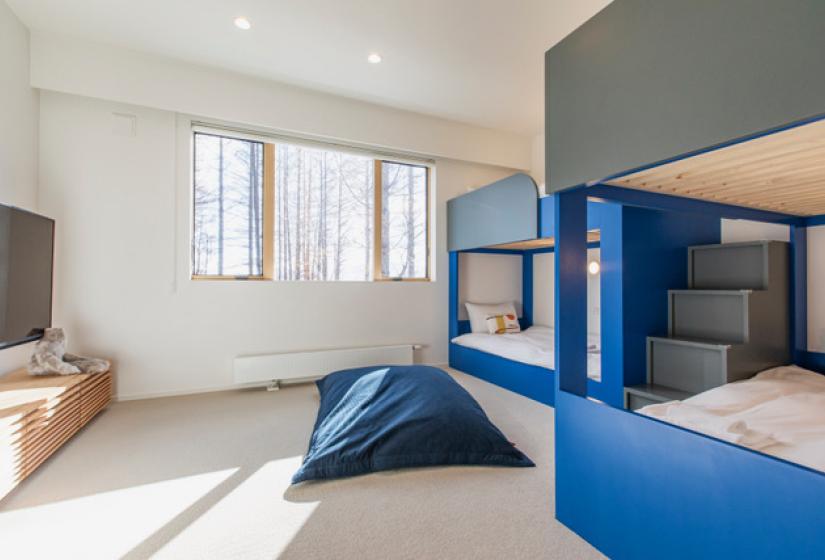 Two sets of bunks with bean bag on ground