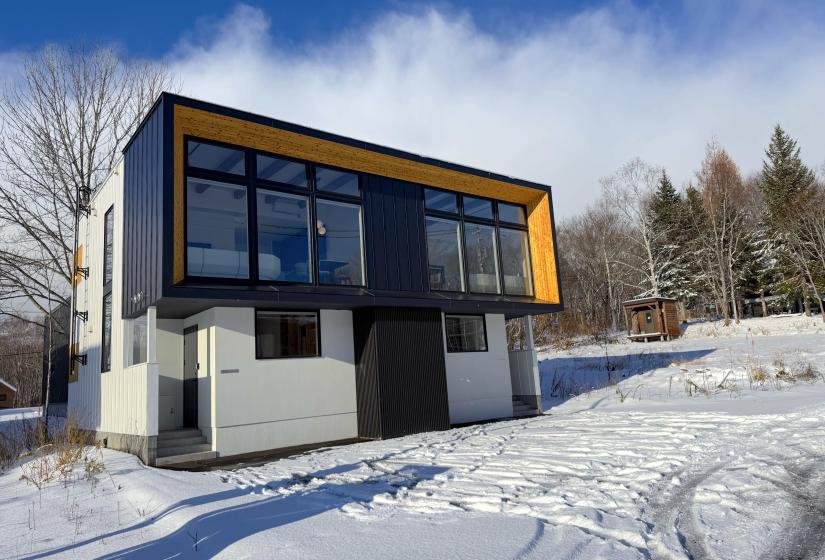 The exterior of a two story townhouse in the snow