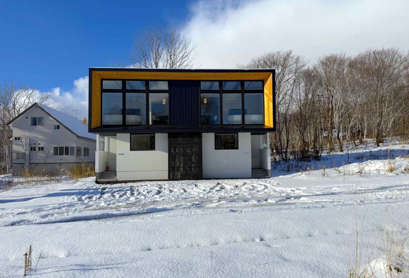 The exterior of a two story townhouse in the snow