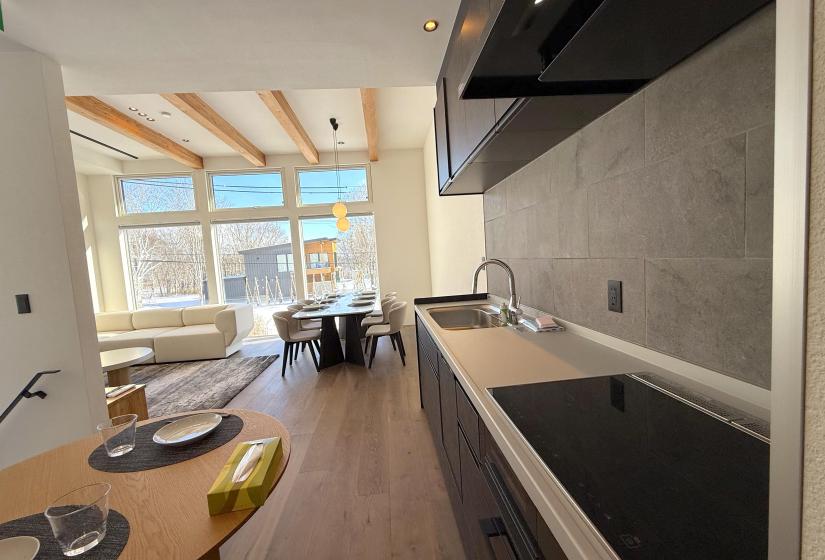 A kitchen bencj and dining table behind.