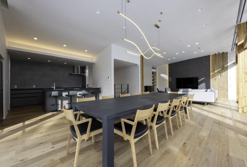 A dining table and TV behind