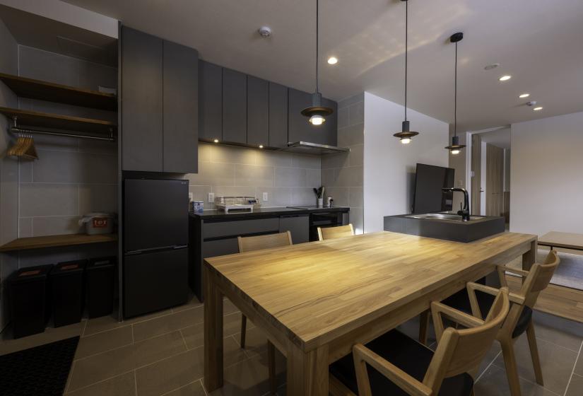 A dining table with pendant lighting