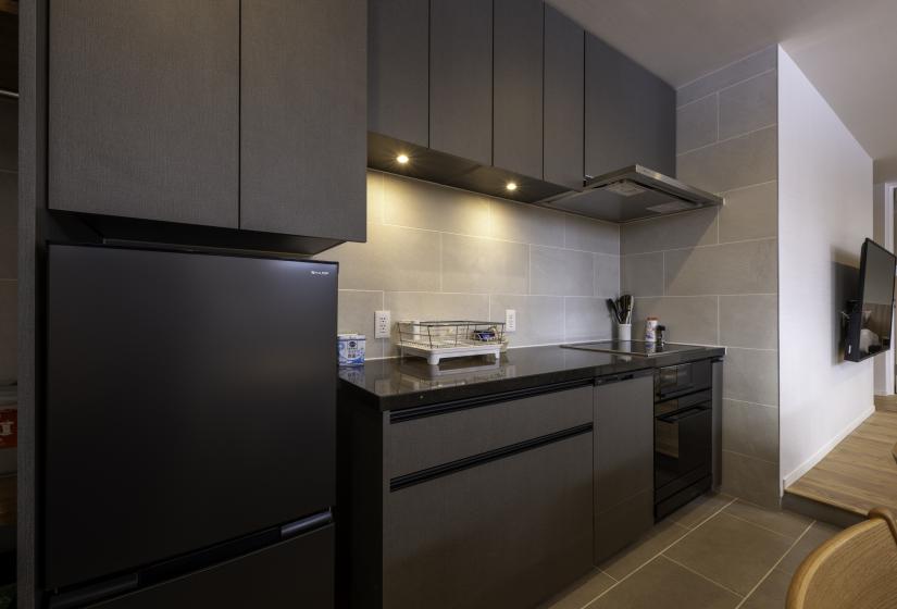 A dark colored kitchen