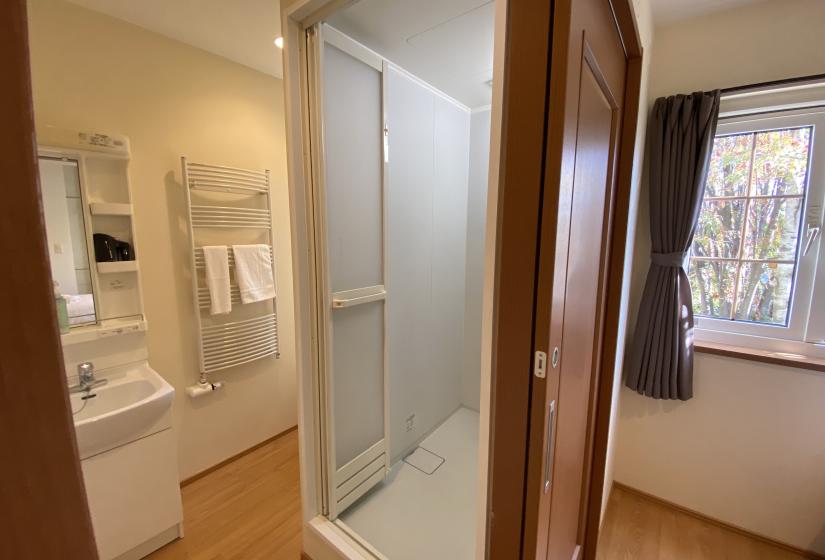 A bathroom sink and window to the right